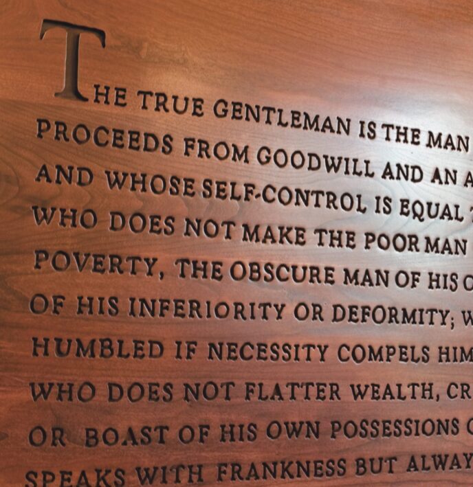 SAE True Gentleman creed etched into wood