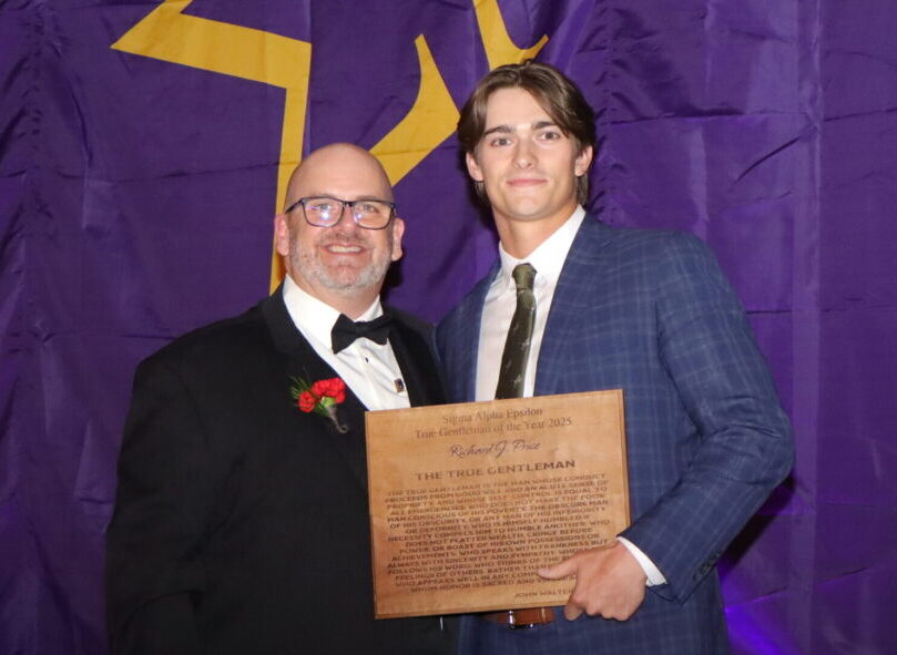 SAE brother receiving an award