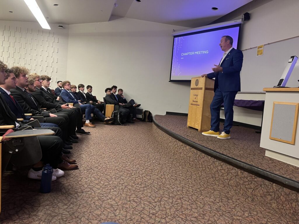 Dr. Neil McKinnon speaking at Michigan University