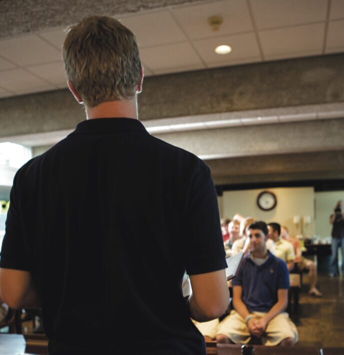SAE brother speaking to a group of brothers