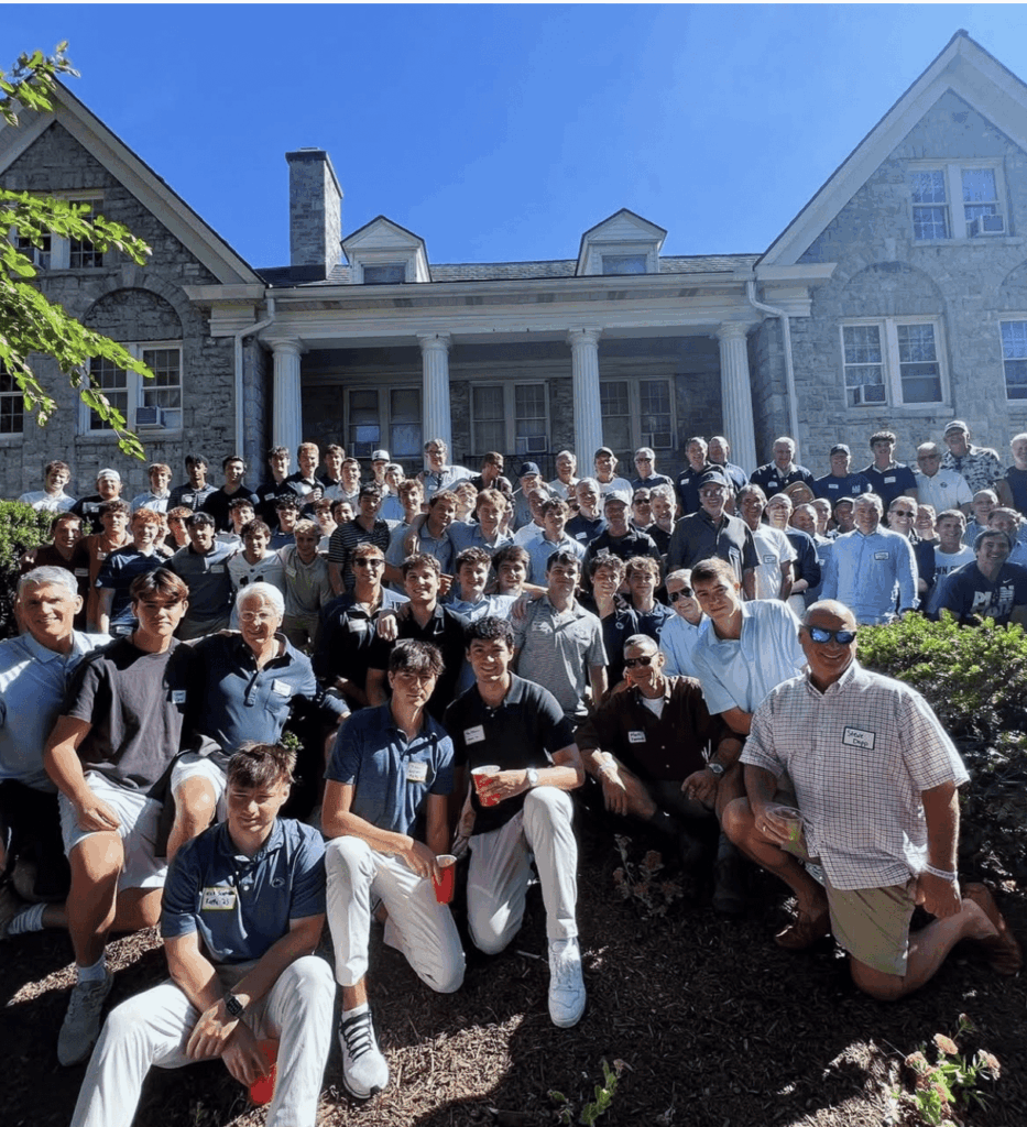 group photo of SAE members outside house