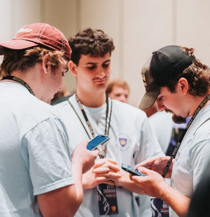 SAE brothers working on their phones