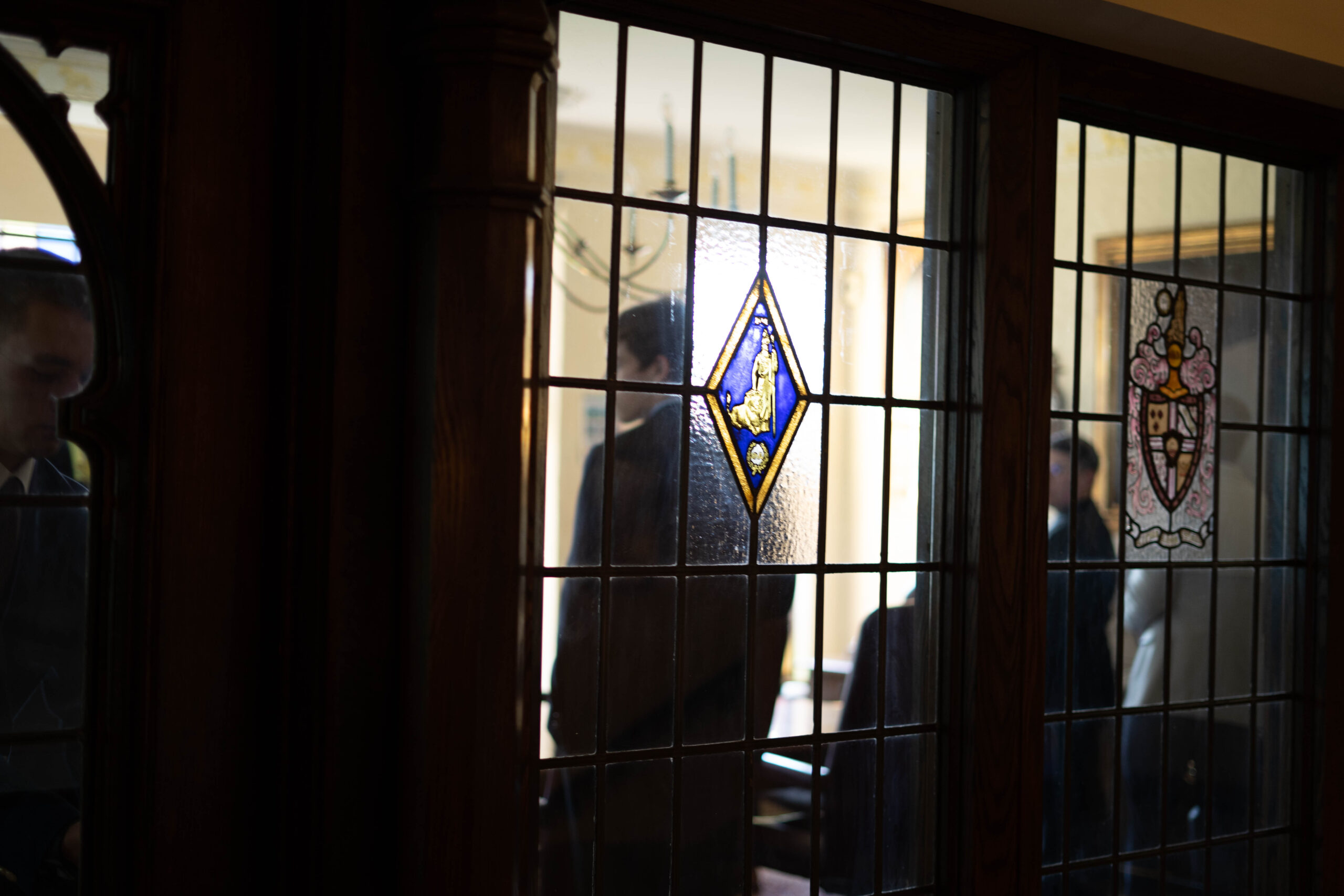 view from outside through stained glass to two SAE brothers