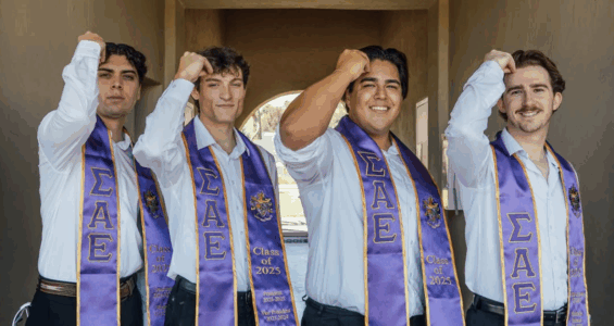4 SAE brothers wearing fraternity saches