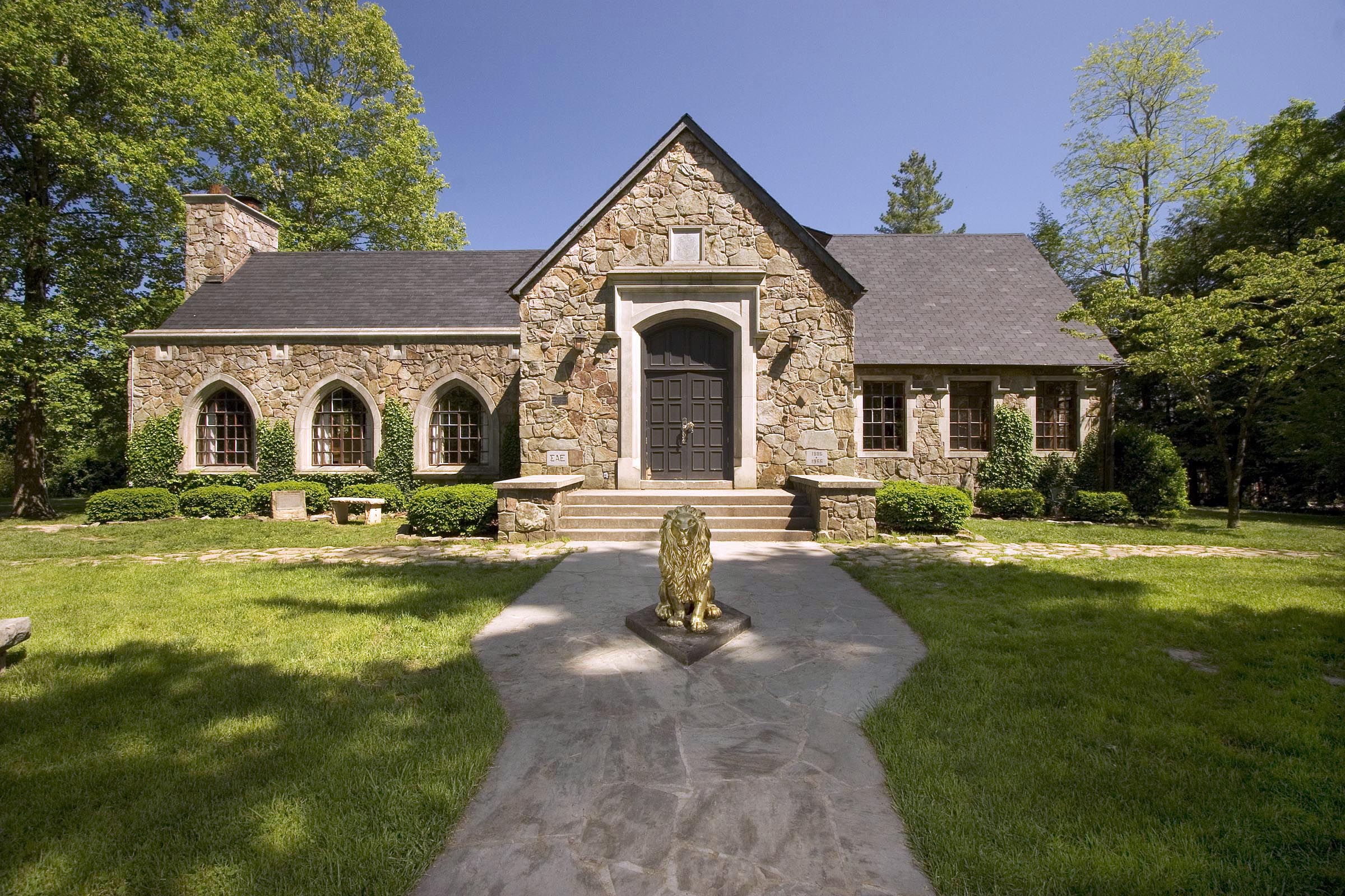 Sewanee house with lion statue in front