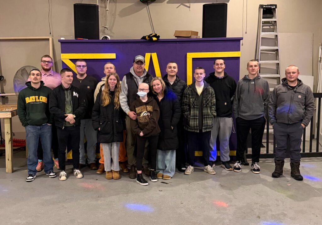 Michigan Delta Raises Nearly $8,000 for Leukemia Awareness at “Haircuts for Heroes” Event